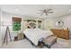 Large bedroom with rustic wood headboard, ample natural light, and neutral decor at 10311 Windtree Ln, Charlotte, NC 28215