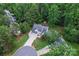 Aerial shot showcases the property's well-manicured lawn, mature trees, and long driveway at 107 Glenmont Ct, Mooresville, NC 28117