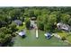 Aerial shot of waterfront property with a private dock, boat slips, and lush greenery at 107 Glenmont Ct, Mooresville, NC 28117