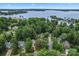 Stunning aerial view of waterfront homes surrounded by lush greenery and a tranquil lake at 107 Glenmont Ct, Mooresville, NC 28117