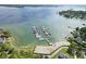 Breathtaking aerial view of a marina with multiple boats docked, surrounded by serene waters and lush landscapes at 107 Glenmont Ct, Mooresville, NC 28117