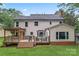 Expansive backyard featuring a large deck, pergola, and well-maintained lawn perfect for outdoor gatherings at 107 Glenmont Ct, Mooresville, NC 28117