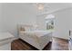 This bedroom is bright and airy, showcasing a sunlit window and a comfortable bed at 107 Glenmont Ct, Mooresville, NC 28117