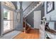 Welcoming entryway with hardwood floors, a staircase, and natural light at 107 Glenmont Ct, Mooresville, NC 28117