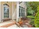 Welcoming front porch with a decorative door and tasteful landscaping, enhancing the home's curb appeal at 107 Glenmont Ct, Mooresville, NC 28117