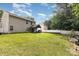 Backyard with spacious green lawn and back exterior at 10816 Pointer Ridge Dr, Charlotte, NC 28214