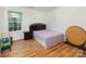 Bedroom with wood floors, neutral walls, one window, and simple furnishings at 10816 Pointer Ridge Dr, Charlotte, NC 28214