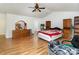 Large bedroom showcases ample natural light, wood floors, and dark wood furniture at 10816 Pointer Ridge Dr, Charlotte, NC 28214
