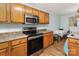 Functional kitchen featuring stainless steel appliances, light cabinets, and breakfast area at 10816 Pointer Ridge Dr, Charlotte, NC 28214