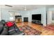 Spacious living room features fireplace, ceiling fan, hardwood floors and natural light at 10816 Pointer Ridge Dr, Charlotte, NC 28214