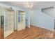 Light-filled living room with hardwood floors, chandelier, and ample space for furniture at 10816 Pointer Ridge Dr, Charlotte, NC 28214