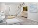 Open-concept space featuring a staircase, a cabinet, and a sofa with stylish decor at 11034 Engelmann Ln, Charlotte, NC 28269