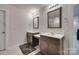 Bright bathroom with double vanity sinks, granite countertops, framed mirrors, and modern light fixtures at 1195 Cavalier Ln, Rock Hill, SC 29730