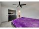 Well-lit bedroom featuring a ceiling fan, spacious dresser, and a comfortable bed with purple blanket at 1195 Cavalier Ln, Rock Hill, SC 29730