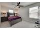Inviting bedroom with natural light, a stylish ceiling fan, and cozy bed with a purple blanket at 1195 Cavalier Ln, Rock Hill, SC 29730