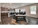 Open-concept dining area with a modern table set and kitchen view at 1195 Cavalier Ln, Rock Hill, SC 29730