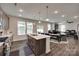 Open-concept kitchen boasts an island, pendant lighting, and stainless steel appliances at 1195 Cavalier Ln, Rock Hill, SC 29730