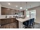 Modern kitchen featuring an island with pendant lighting, stainless appliances and white backsplash at 1195 Cavalier Ln, Rock Hill, SC 29730