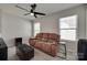 Cozy living room with neutral walls, plush carpet, comfortable seating, and natural light from a large window at 1195 Cavalier Ln, Rock Hill, SC 29730