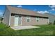 Backyard features a concrete patio, sliding glass door, and well-maintained lawn at 1195 Winding Creek Rd, Salisbury, NC 28146
