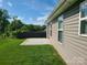 Exterior view of home backyard featuring stone patio and wood fence at 1195 Winding Creek Rd, Salisbury, NC 28146