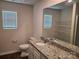An elegant bathroom featuring granite counters, ample lighting, and a functional layout at 1195 Winding Creek Rd, Salisbury, NC 28146