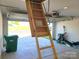 Attached garage featuring pull down ladder and white paneled door at 1195 Winding Creek Rd, Salisbury, NC 28146