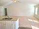 An inviting living space with a partially-visible kitchen area and light-filled atmosphere at 1195 Winding Creek Rd, Salisbury, NC 28146