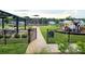 Community playground with play structure, covered picnic area, and walking path, perfect for Gathering fun and outdoor activities at 1195 Winding Creek Rd, Salisbury, NC 28146