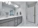 Bathroom with double vanity, neutral cabinets, and ample lighting at 12024 John Newton Dr, Davidson, NC 28036