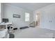 Versatile spare bedroom featuring neutral walls and plush carpeting, perfect for relaxation or work at 12024 John Newton Dr, Davidson, NC 28036