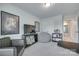 Cozy bedroom area featuring a lounge chair, television, and unique decorative elements at 12024 John Newton Dr, Davidson, NC 28036