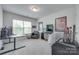 Neutral bedroom featuring a desk, a comfy chair, and movie posters at 12024 John Newton Dr, Davidson, NC 28036