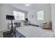 Bright bedroom, perfect for a home office, with natural light and neutral decor at 12024 John Newton Dr, Davidson, NC 28036