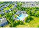 Bird's eye view of an attractive neighborhood pool, clubhouse, and lounge chairs in a verdant setting at 12024 John Newton Dr, Davidson, NC 28036