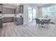 This dining area features a round table, seating for four, and a view of the kitchen with access to the patio at 12024 John Newton Dr, Davidson, NC 28036