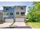 Attractive townhome featuring a private balcony and a well-maintained front lawn at 12024 John Newton Dr, Davidson, NC 28036