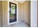 Front door of the home with a wreath and 'Hello' doormat at 12024 John Newton Dr, Davidson, NC 28036