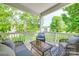 Relaxing porch area with comfortable seating and scenic views of surrounding greenery at 12024 John Newton Dr, Davidson, NC 28036