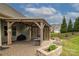 Backyard features a beautiful patio area with custom pergola and decorative planter boxes at 132 Hillston Ln, Mooresville, NC 28115