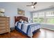Bright bedroom with large windows and ceiling fan at 132 Hillston Ln, Mooresville, NC 28115