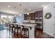 Modern kitchen with granite countertops, stainless steel appliances, and pendant lighting at 132 Hillston Ln, Mooresville, NC 28115