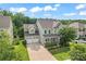 Aerial view of a two-story home with a well-kept yard and an attached two-car garage at 133 Yellowbell Rd, Mooresville, NC 28117