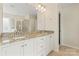 Bathroom featuring double sinks, granite countertops, and large mirror at 133 Yellowbell Rd, Mooresville, NC 28117