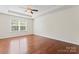 Spacious bedroom features tray ceilings, ceiling fan, and a large window at 133 Yellowbell Rd, Mooresville, NC 28117