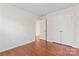 Bright bedroom with hardwood floors and a double door closet at 133 Yellowbell Rd, Mooresville, NC 28117