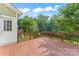 View of the outdoor wooden deck perfect for relaxation and entertainment with a large backyard at 133 Yellowbell Rd, Mooresville, NC 28117