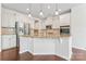 Modern kitchen boasting granite countertops, stainless steel appliances, and custom cabinetry at 133 Yellowbell Rd, Mooresville, NC 28117