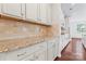 Granite countertops and cream-colored cabinetry add a touch of elegance to this well-equipped kitchen at 133 Yellowbell Rd, Mooresville, NC 28117