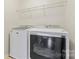 Laundry room with white Maytag washer and dryer at 133 Yellowbell Rd, Mooresville, NC 28117